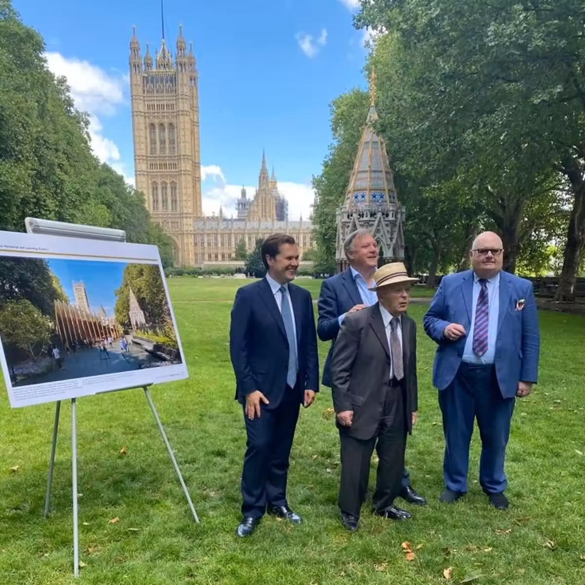Secretary of State Robert Jenrick (left) poses with a Holocaust survivor in front of the Memorial project at its future location in July 2021 (Robert Jenrick / Twitter)